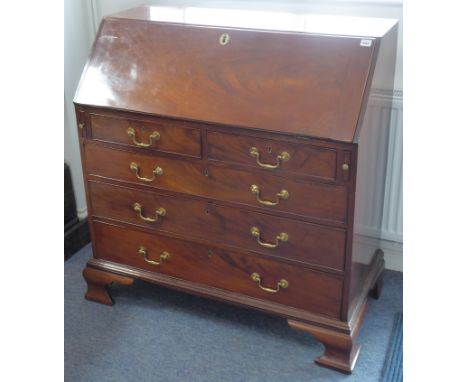 A good late-18th century mahogany writing bureau; cleated fall opening to reveal fully fitted interior with mirrored door, sl