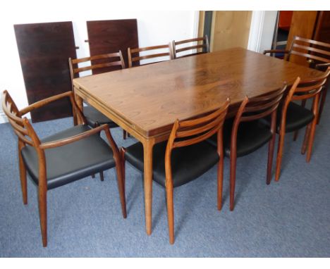 A fine mid-20th century Danish extending rosewood dining table' together with eight (6+2) matching dining chairs; the table w