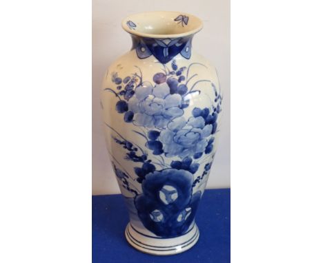 A 19th century Chinese porcelain baluster-shaped vase; hand-decorated in underglaze blue with three butterflies to the interi