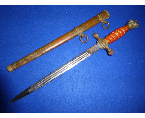 A circa 1937 Kriegsmarine officer's dagger; the 24.5cm blade marked 'WKC' with knight's head above and in near fine condition