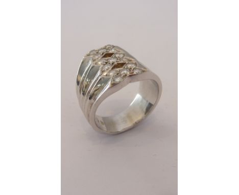 A heavy 18-carat white gold designer ring set with 15 diamonds