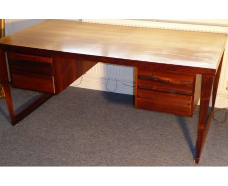 A good Danish rosewood writing desk designed by Kai Kristiansen (Danish, born 1929); free standing model 70, central knee-hol
