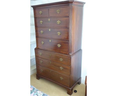 A late 18th century mahogany chest-on-chest; the outset cornice above an arrangement of two half-width and three full-width d