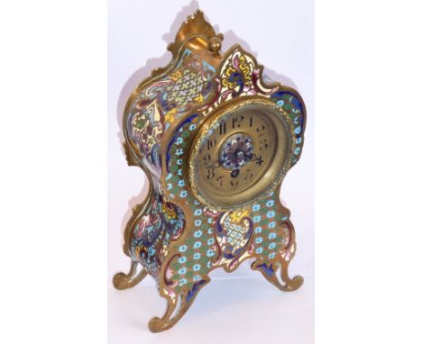 A champlevé mantel clock with gold-coloured chapter ring with Arabic numerals surrounding a central enamel circular motif, wi