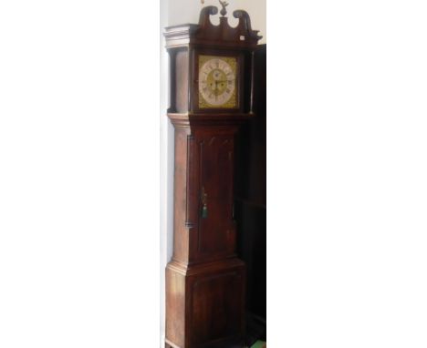 A George III period oak-cased eight-day longcase clock; broken swan-neck pediment surmounted by a central eagle above a 12" d