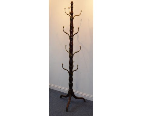 An early 19th century Regency period mahogany country house style hat-and-coat stand with four rows of cast brass pegs; bobbi