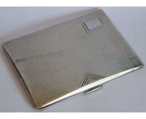 A heavy Art Deco period hallmarked silver cigarette case; engine-turned decoration and vacant rectangular cartouche, approx. 