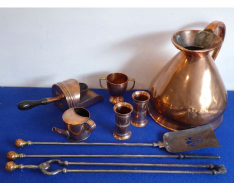 A group of, mostly 19th century, copper and other metalware to include: a large copper two-gallon measuring jug with high scr