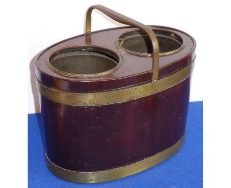 A fine late-18th/early-19th century oval, mahogany and brass coopered double bottle-carrier with rigid brass carrying handle,