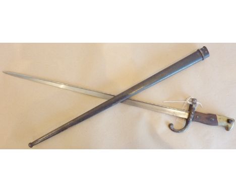 A French Model 1874 Gras Bayonet and scabbard, clean blade marked 'St.  Etienne, Avril 1876', minor pitting and surface corro