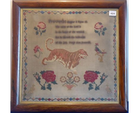 An early/mid 19th century rosewood-framed and glazed sampler Proverbs Chapter 3 Verse 33 depicting flowers, a tiger, birds et
