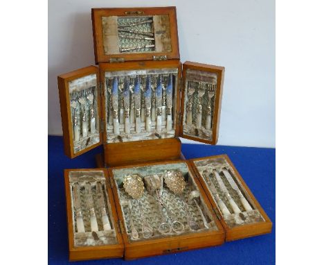 A fine 19th century silver-plated dessert service: two pairs of nut crackers, a set of 12 silver-plated and mother of pearl h