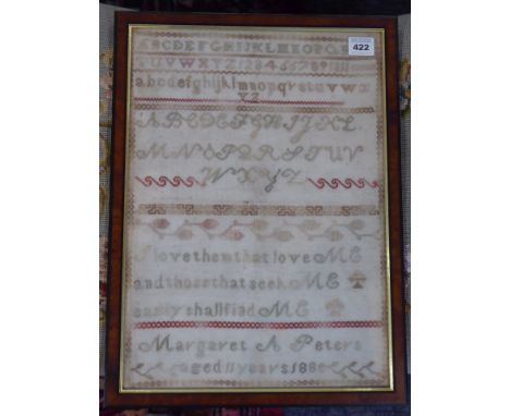 A framed and glazed late-19th century needlework sampler: Margaret A. Peters, aged 11 years 188?; 41.5cm x 30cm  CONDITION RE