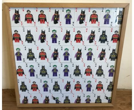 A framed and glazed montage of Lego Batman playing cards. A full set with 2 jokers depicting Batman, Batgirl, Robin and The J