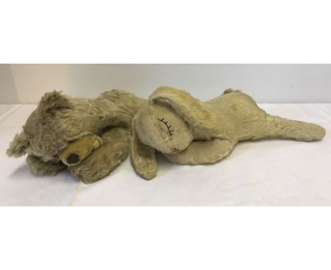 2 vintage Steiff 'floppy' soft toys. Comprising:- 1) Floppy Zotty Bear (missing button), and 2) Floppy sleeping rabbit (with 