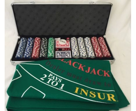 A large aluminium cased poker/blackjack set. Case contains playing chips, dice and cards. Together with a Blackjack felt tabl