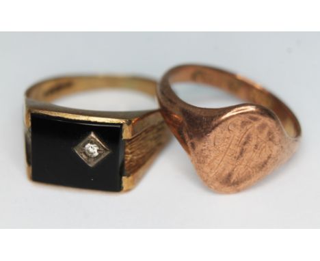 Two hallmarked 9ct gold signet rings, one set with an onyx slab and a diamond, gross wt.7.98g, size P/R.  