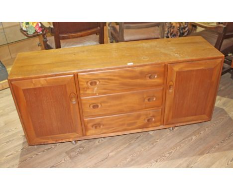 An Ercol light elm sideboard, length 156cm.  Some general wear to include marks and light surface scratches to the top.