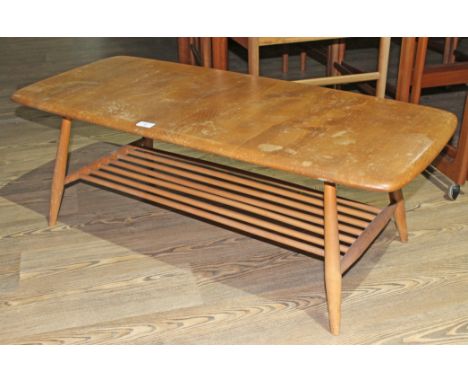 An Ercol light elm coffee table, length 114cm.  Some general wear to include marks and light surface scratches to the top.