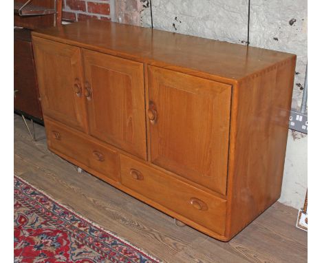 An Ercol blonde elm sideboard.  Condition - general wear including marks to top, scratches etc.