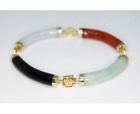 A Chinese 14ct gold and jade bracelet, marked '14k', 'HKONG' and with 14ct gold import marks, length 18cm, gross wt. 17.80g. 