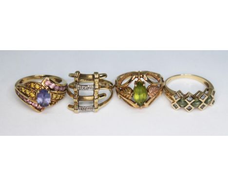 Three hallmarked 9ct gold rings and another marked 10K', gross wt. 12.55g, size K-M.  