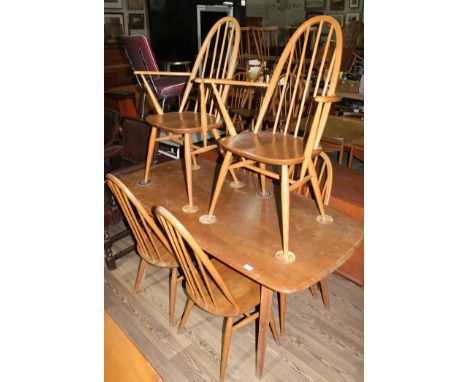 An Ercol light elm 'Plank' table and six 'Quaker' chairs, height 72cm, length 153cm and width 77cm.  There are some surface m