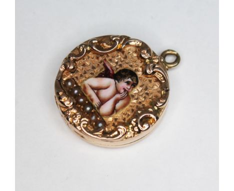 An antique locket, scroll border surrounded a central enamel winged cherub above a single row of pearls, diam. 17mm, unmarked