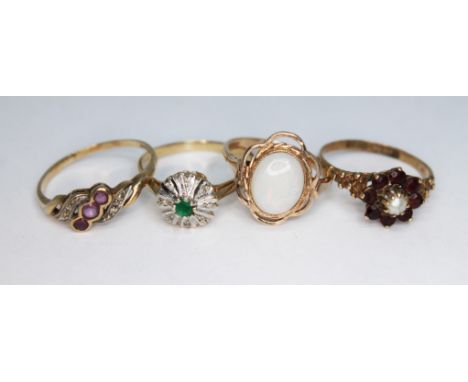 A group of four hallmarked 9ct gold rings, various settings, gross wt. 8.74g, size N-R.  
