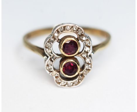 A ruby and diamond cluster ring, the cluster measuring approx. 14mm x 10mm, marked '9c', gross wt. 2.93g, size R/S.  