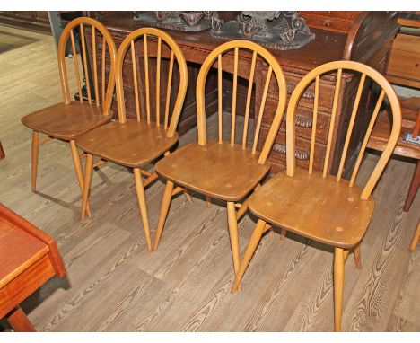 A set of four vintage Ercol light elm and beech 'Windsor' chairs.  Good solid condition with no loose joints or wobbles. Ther