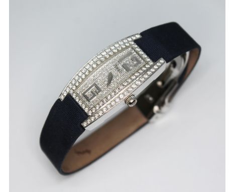 A ladies Piaget Limelight Tonneau 18ct white gold pave set diamond watch, ref. G0A26055, serial no. 919656, sapphire crystal 