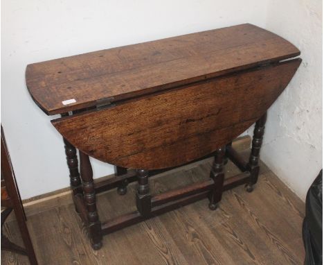 An 18th century oak gate leg table.Condition:- General wear through age and use, no sign of any major damage or repair.