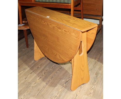 A modern Ercol light elm drop leaf table, height 73cm, width 107cm and depth 22cm opening to 121cm.  Excellent condition, no 