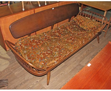 A vintage Ercol dark elm and beech 'Studio Couch' day bed, length 206cm, depth 78cm and height 76cm.  Good solid condition wi