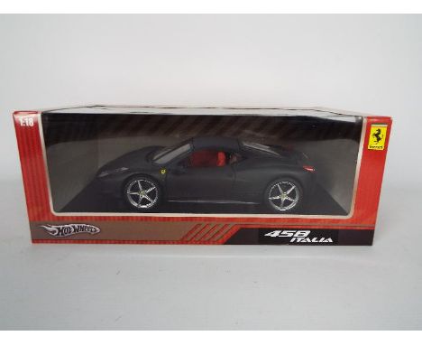 Hot Wheels - A boxed 1:18 scale Hot Wheels #6921 Ferrari 458 Italia. The model in Black appears to be in Mint condition house