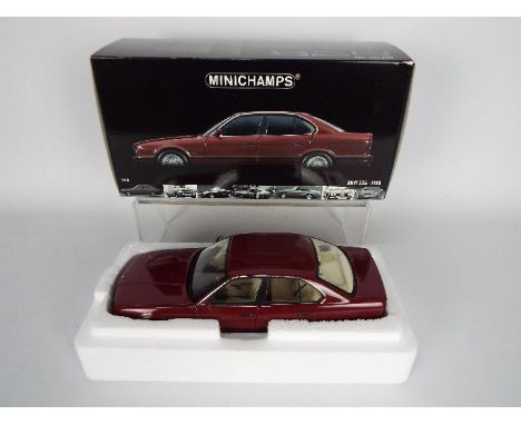 Minichamps - A boxed 1:18 scale BMW E34 535i # 100024002. This model appears in Near Mint condition with only light signs of 