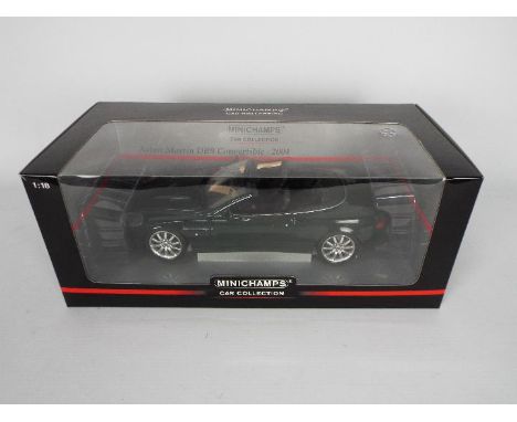 Minichamps - A boxed Minichamps #130531 1:18 scale Aston Martin DB9 Convertible 2004. . The model in green appears to be in M