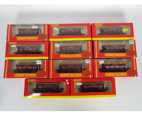 Hornby - 11 boxed Hornby R6084  and R6050 EWS HEA Hopper Wagons. Wagons appear to be in Mint condition in Very Good - Excelle