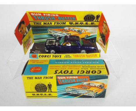 Corgi - A boxed # 497 Thrush Buster Oldsmobile from The Man From U.N.C.L.E. The car shows signs of play use with some paint c
