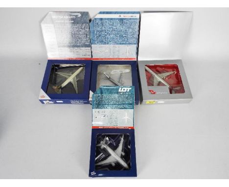 Gemini Jets, Other - Four boxed diecast 1:400 scale model aircraft in various carrier liveries . Lot includes Gemini Jets GJA