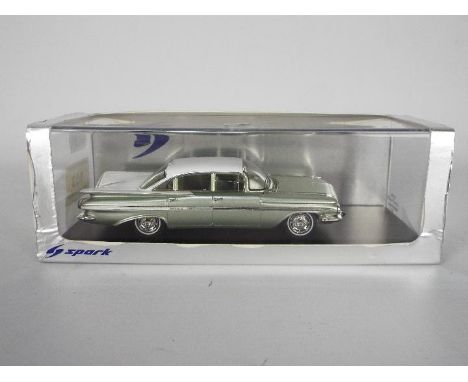 Spark - A boxed 1:43 scale Spark S2904 1959 Chevrolet Impala Six Window Sedan. The resin model in mint green and white appear