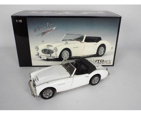 AutoArt Millenium - A boxed AutoArt 1:18 scale Austin Healey 3000. The model in white appears to be in Good overall condition