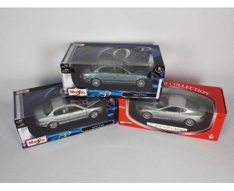 Maisto, Mondo Motors - Three boxed 1:18 scale diecast model cars. Lot includes Maisto Jaguar X-Type; Mondo Motors Aston Marti