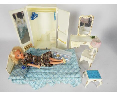 Pedigree Sindy bedroom set made under license by Marx, USA, to include wardrobe, dressing table, bedside table with lamp, and