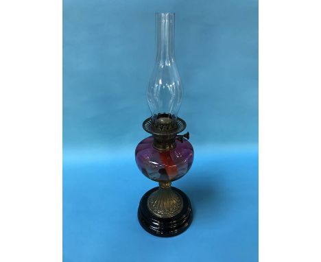 Oil lamp with a cranberry reservoir