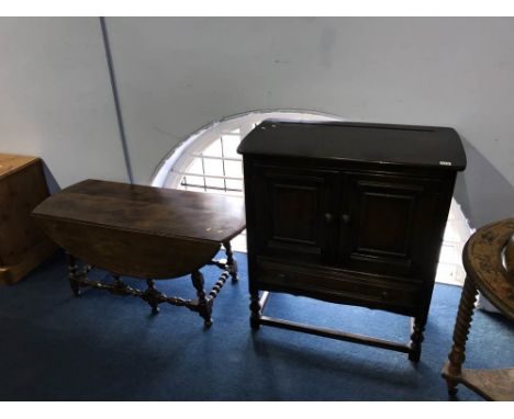 Ercol coffee table and a two door cabinet