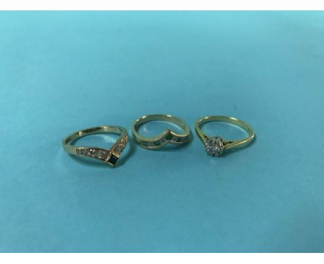 Two 9ct rings, 4g and an 18ct ring, 2.7g