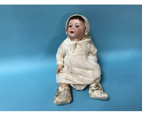 An Armand Marseille bisque headed doll with composite body, stamped A10M and D.R.G.M. 259