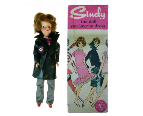 1960's Pedigree Sindy doll, '12GSS Sindy in Weekenders', together with accessories to include; pink dress, red handbag, newsp